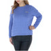 Woman in Superdry women knitwear, blue cable knit sweater featured