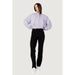 Woman in cropped lavender jacket and black pants from Calvin Klein Jeans Women Jacket