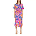 Urban chic: Woman in Vila Clothes dress with tropical print. Shop now at Vila Clothes