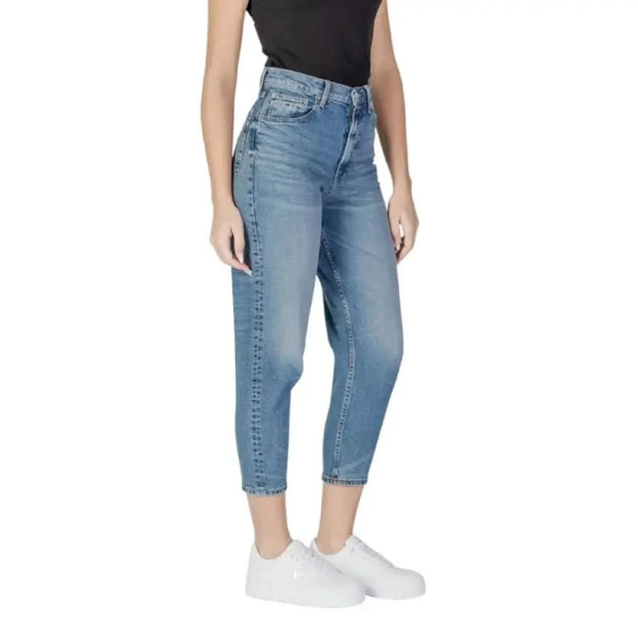 Woman showcasing Tommy Hilfiger Women’s Blue Jeans with Pockets in high-waisted style