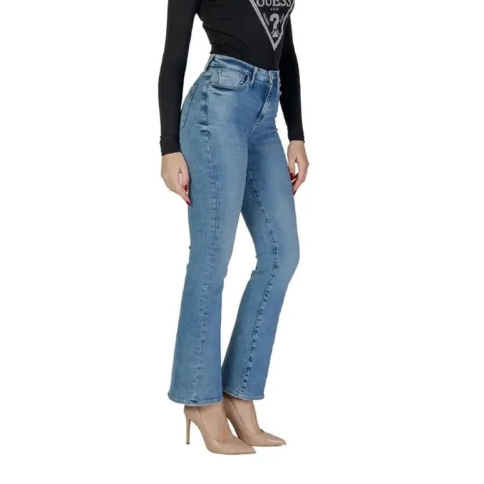 Woman modeling Guess Women’s Light Blue Jeans perfect for Spring and Summer wear