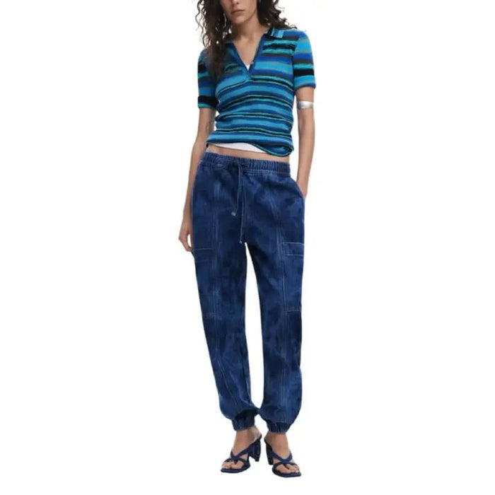 Woman wearing Desigual Women’s Blue Jeans with Lace and Pocket Details in a striped polo