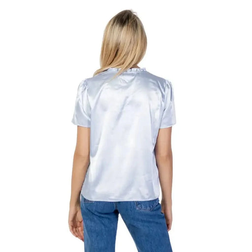 Vila Clothes woman in white blouse and jeans for spring summer collection