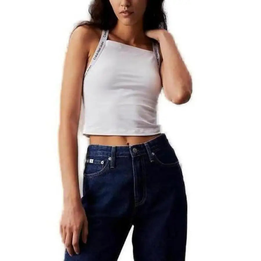 Woman wearing a white crop top and dark blue jeans from Calvin Klein Jeans Women’s Undershirt