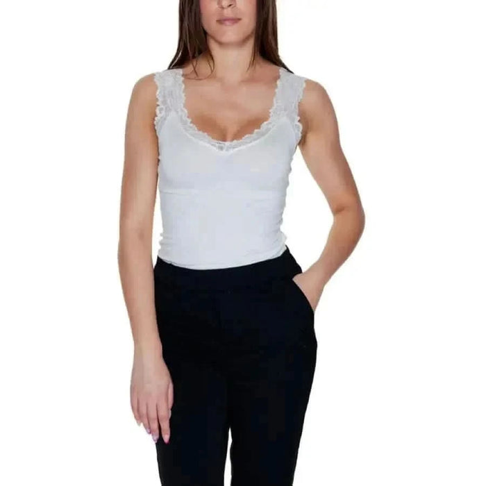 Woman in white lace-trimmed tank top and black pants - Vero Moda Women Undershirt