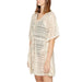 Woman in Vero Moda white lace dress, perfect for urban chic style