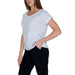 Vila Clothes - Woman in White T-Shirt and Black Pants from the Vila Clothes Collection