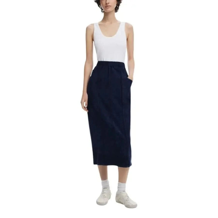 Woman in white tank top and navy skirt modeling Desigual Sleeveless Blue Dress