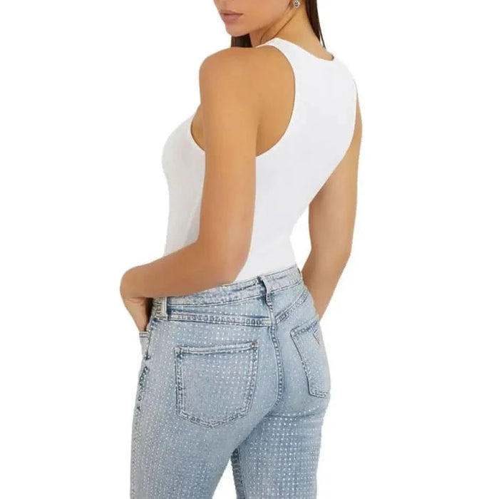 Guess Guess women model posing in white Guess women undershirt and jeans