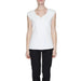 Urban style clothing: Woman in Street One V-neck white top, embodying urban city fashion