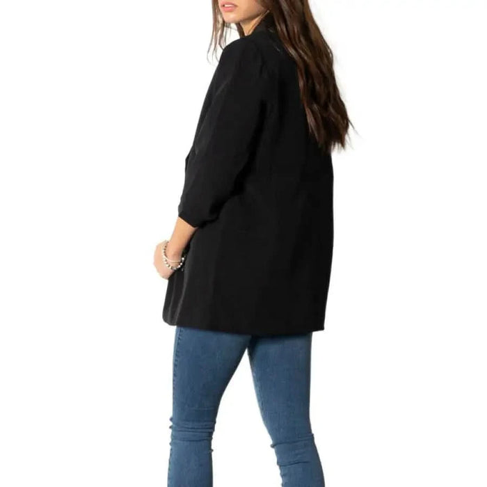 Elegant Women’s Black Blazer with Lapel Collar paired with Blue Jeans for a chic look