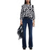 Woman wearing Desigual Black Print Blouse with dark blue jeans in a stylish outfit