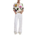 Woman in Desigual Floral Cotton Cardigan with V-Neck and White Jeans Outfit