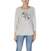 Woman’s long-sleeved white Guess knit sweater with logo and round neck design