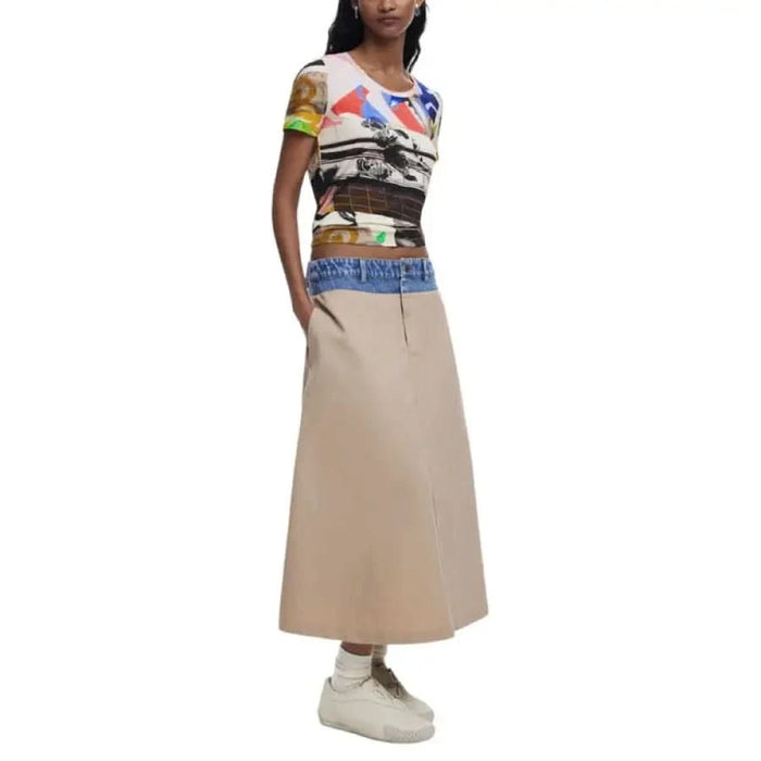 Woman wearing Desigual printed top with beige skirt featuring pockets in cotton blend