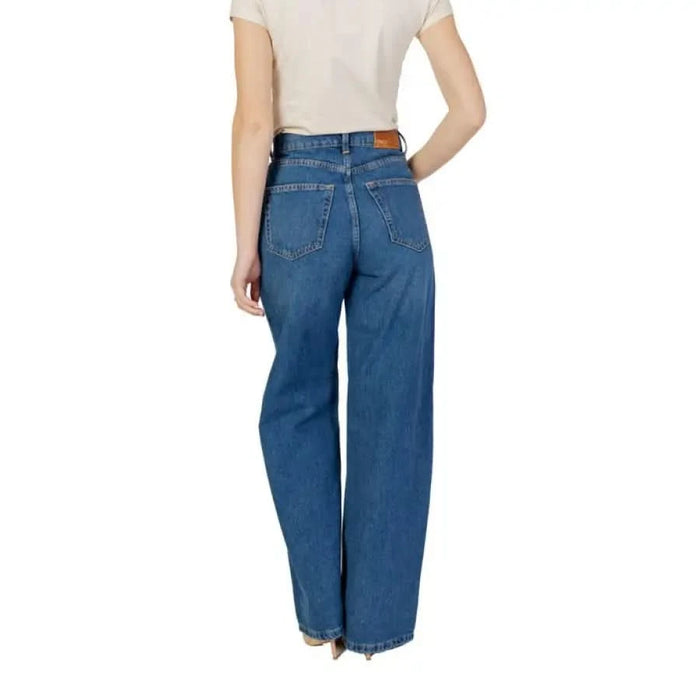 Woman wearing wide-leg blue jeans from the Women’s Blue Plain Cotton Jeans collection