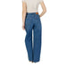 Woman wearing wide-leg blue jeans from the Women’s Blue Plain Cotton Jeans collection