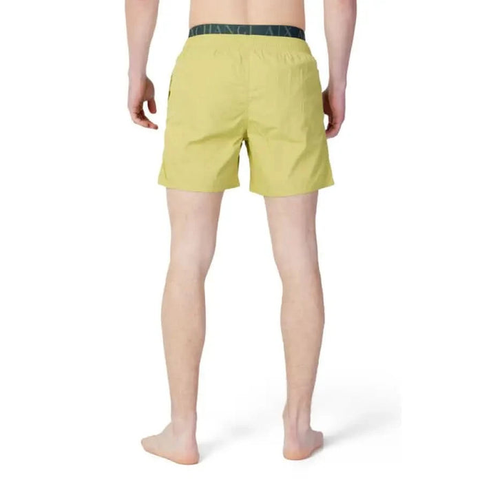 Yellow swim shorts with dark waistband from Armani Exchange Men Swimwear