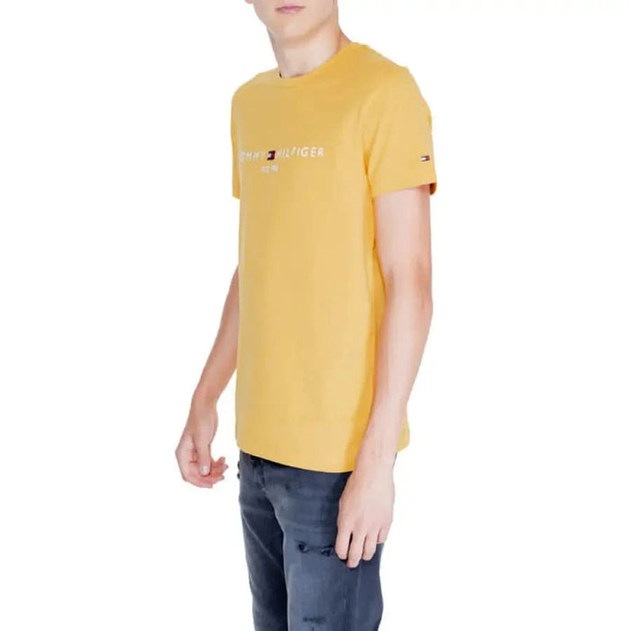 Yellow Tommy Hilfiger T-shirt with logo text on the front for men