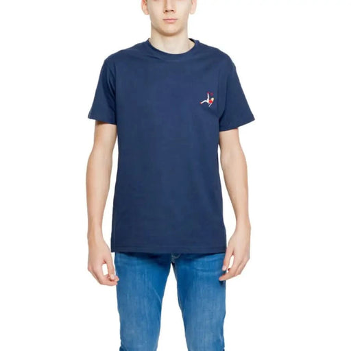 Young boy in navy t-shirt with red-white logo by Hydra Clothing - Urban tee fashion