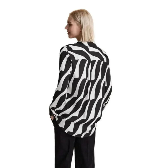 Blonde-haired model showcasing a Zebra-print blouse by Street One